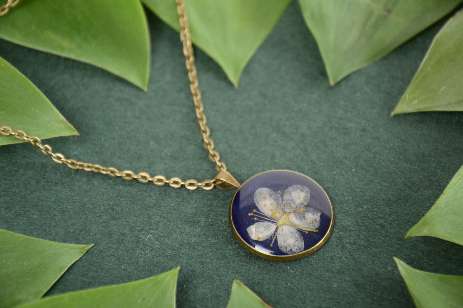 Handmade round blue designer pendant with dried flower in epoxy resin photo 1