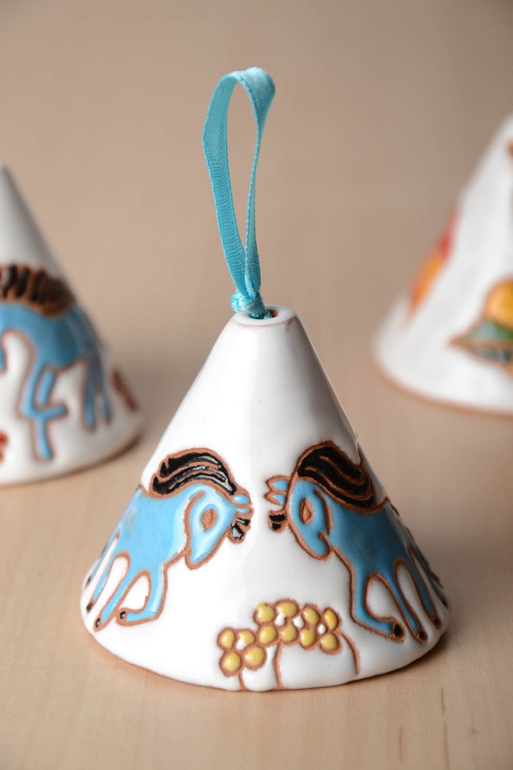 White handmade painted clay bell with horses  photo 1