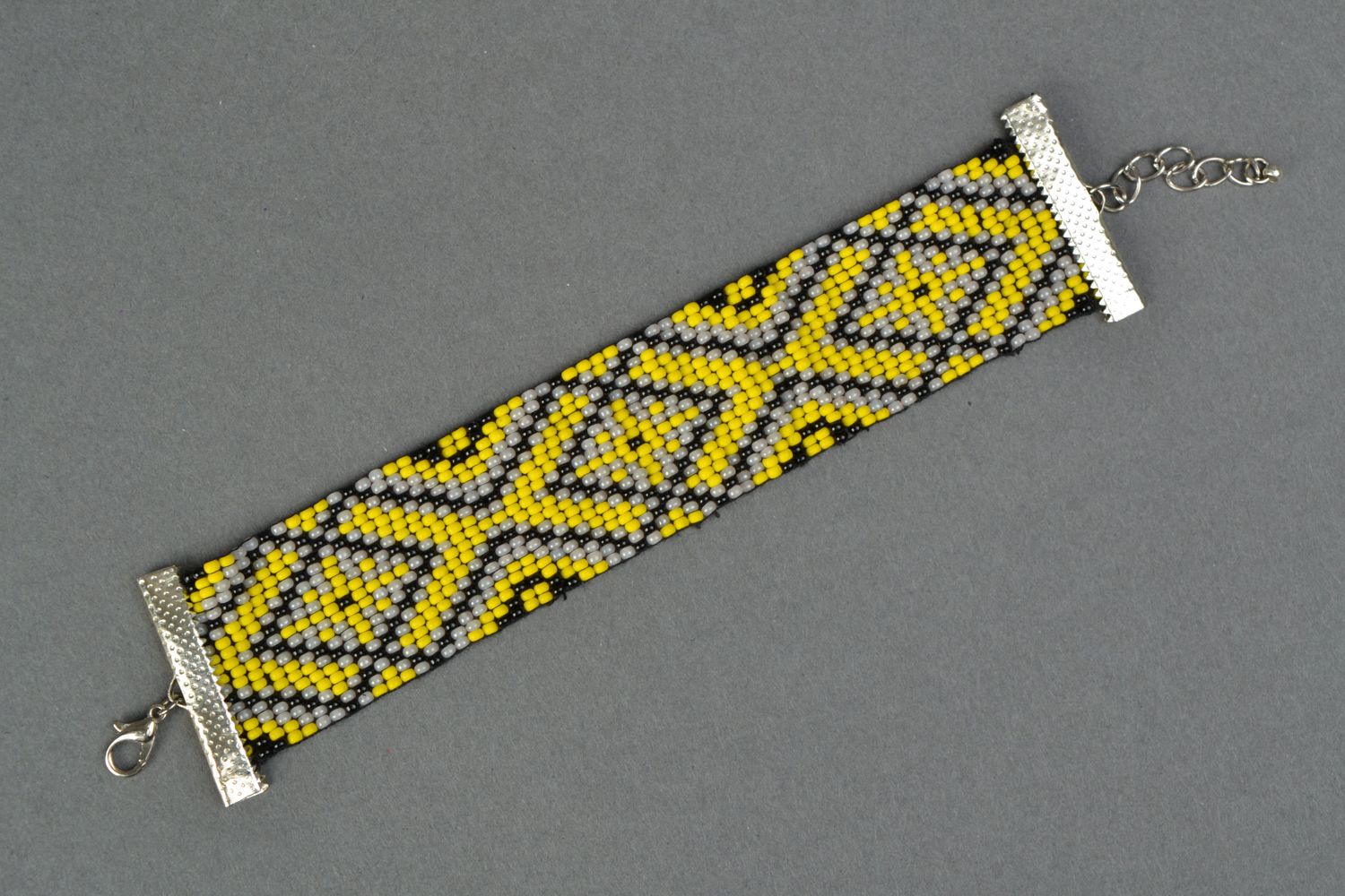 Wide black and yellow ethnic beaded wide bracelet  photo 1