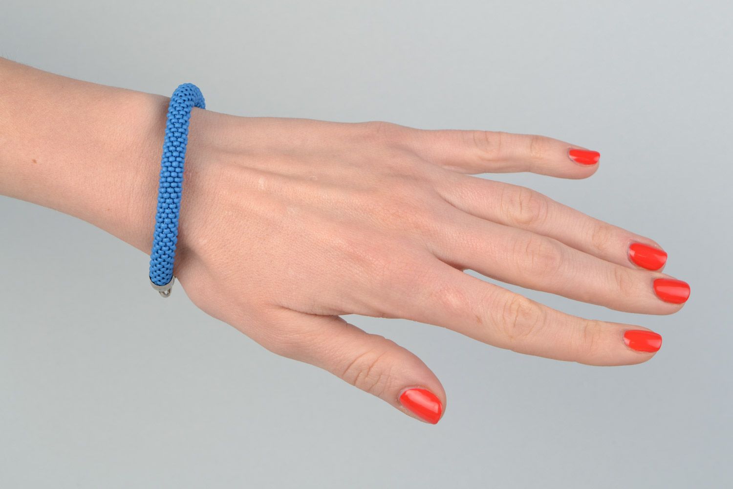 Handmade bright laconic beaded cord wrist bracelet of sky blue color for girl photo 1