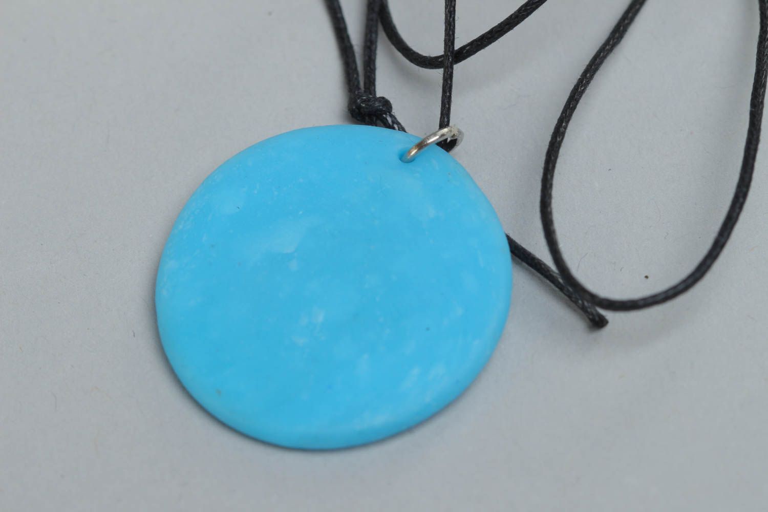 Handmade designer pendant with Ukrainian symbols round blue accessory on cord  photo 4