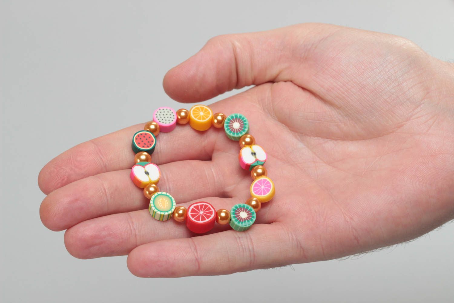 Beautiful bright handmade children's wrist bracelet with polymer clay fruit photo 5