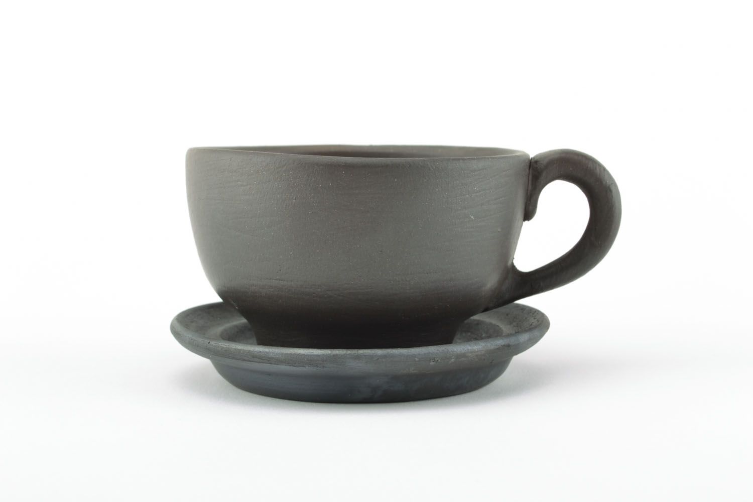 Clay rustic coffee cup in black color without pattern with handle photo 1
