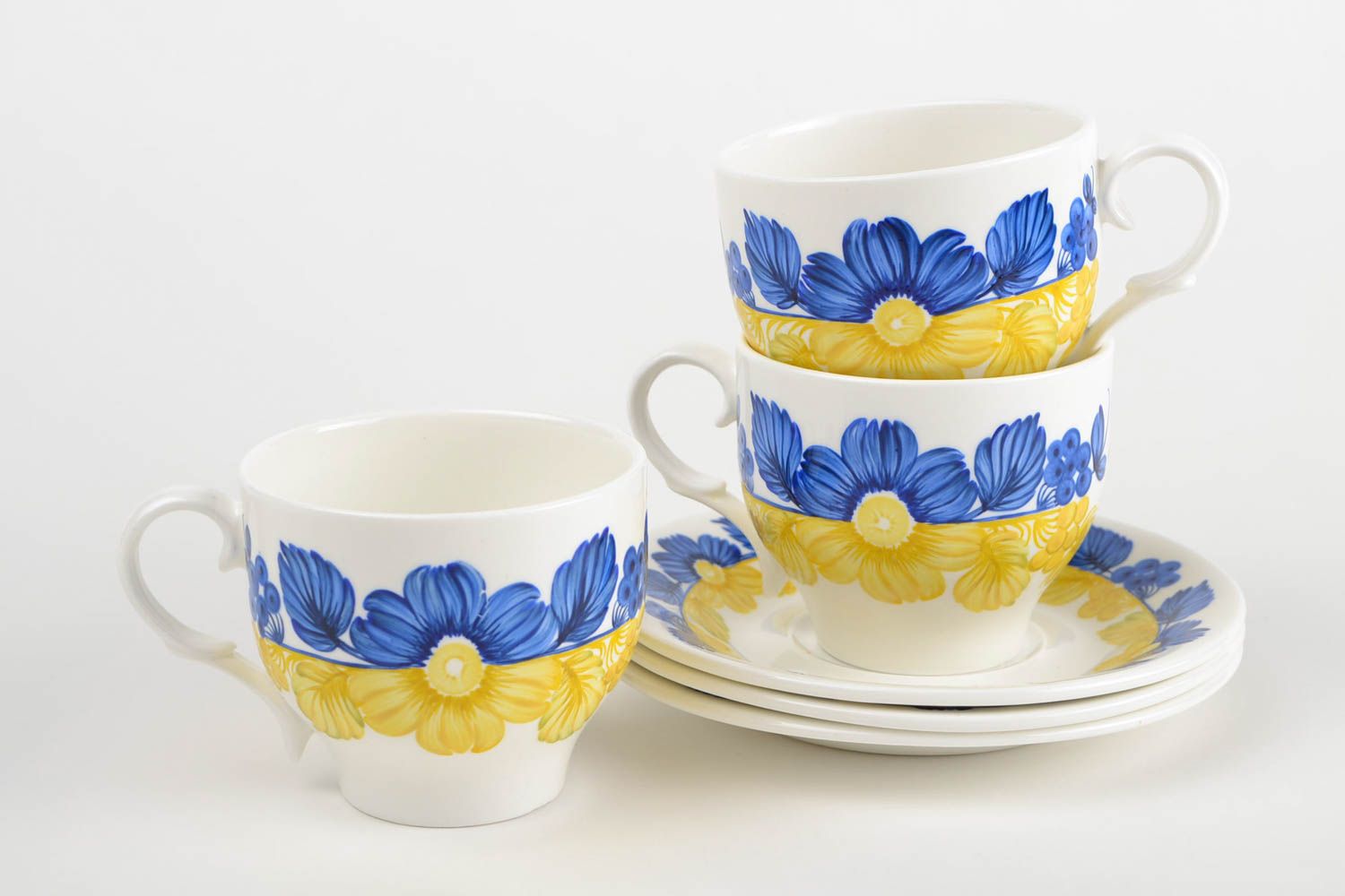 Set of 3 three porcelain white, blue, and yellow colors drinking cups with saucers photo 4