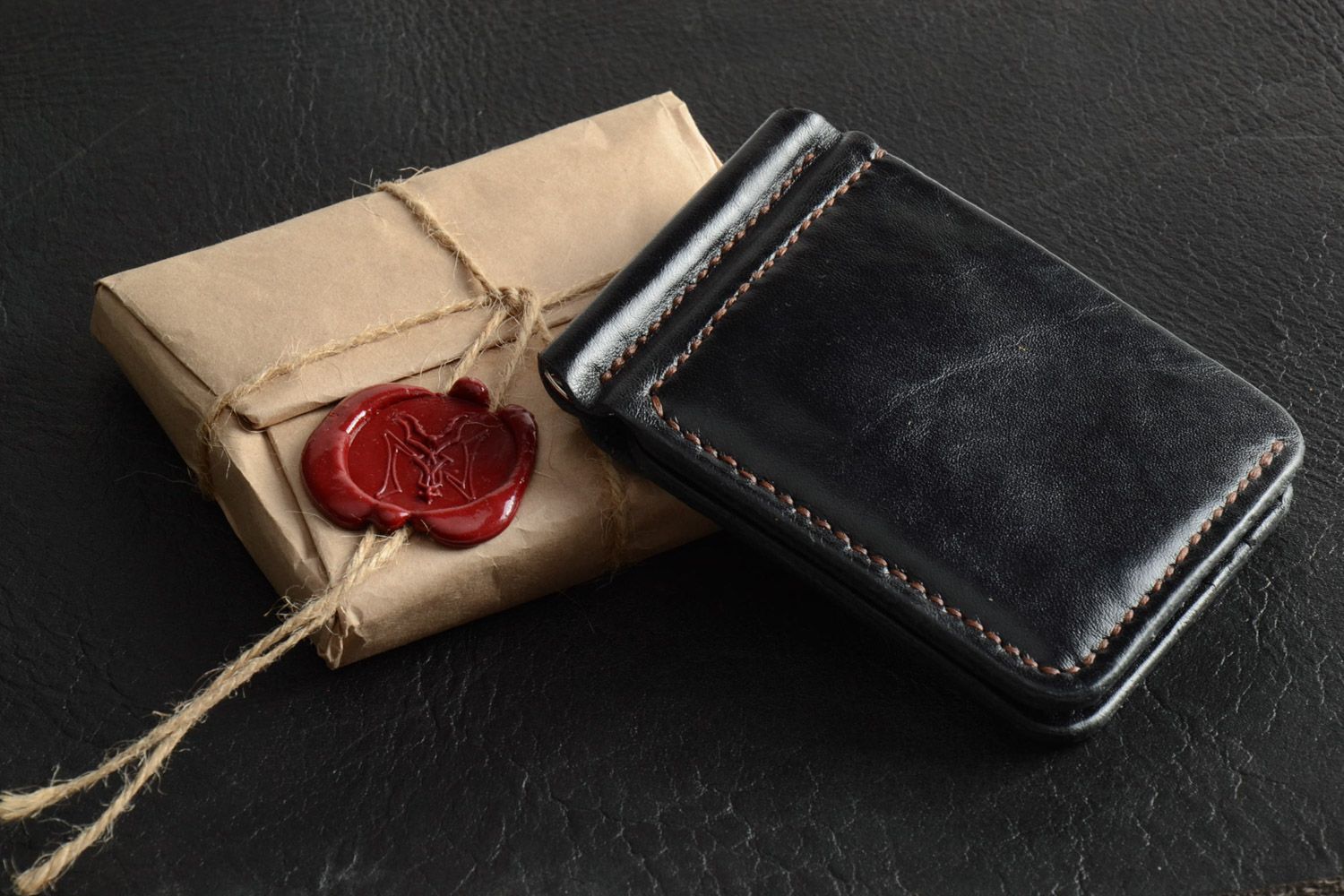 Handmade stylish genuine leather wallet of black color with embossing for men photo 1