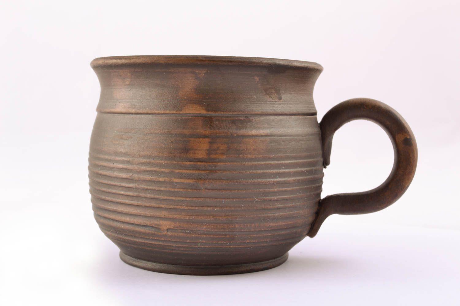 Ceramic drinking cup kilned with milk in rustic design with handle and no pattern photo 2