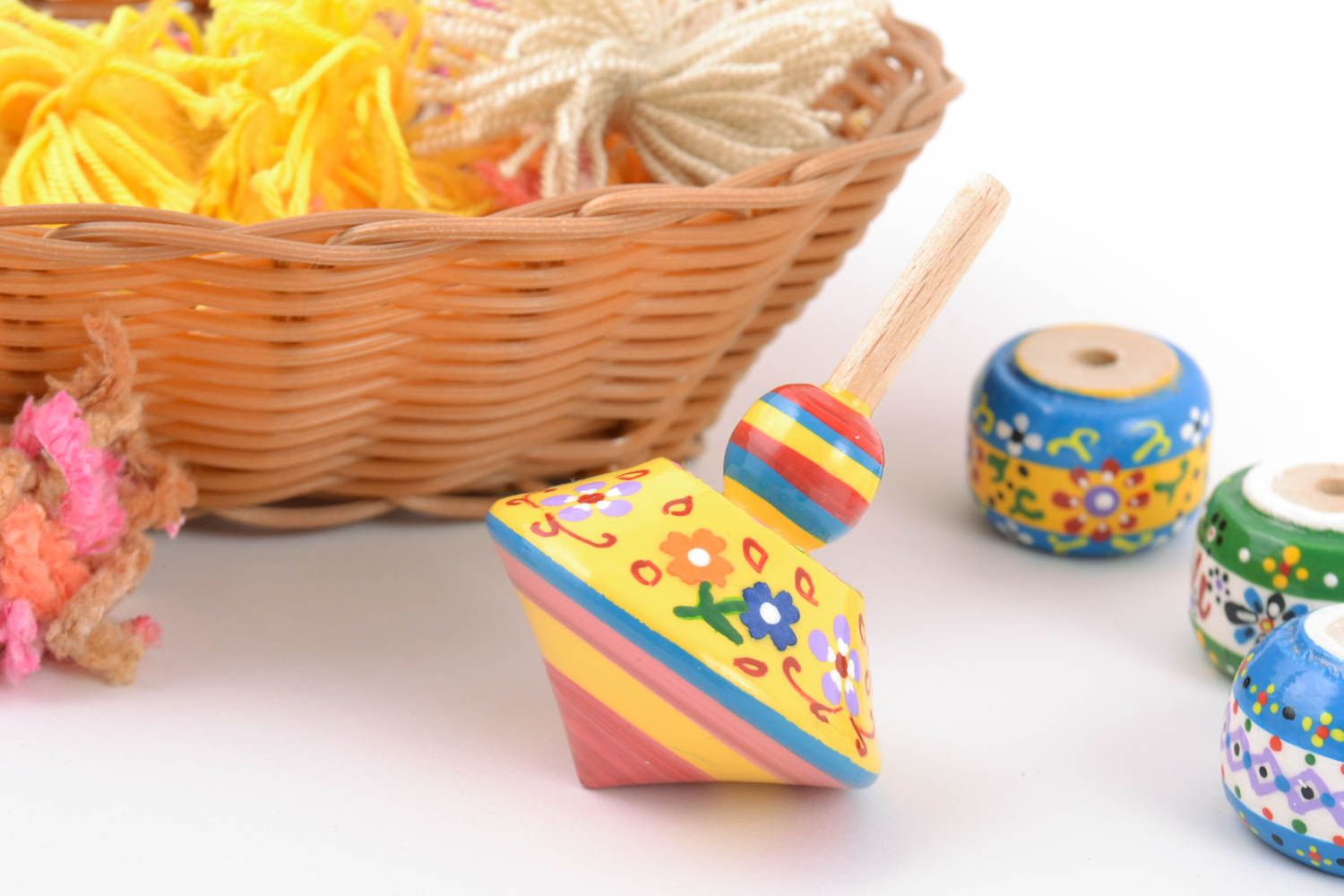 Handmade wooden yellow spinning top toy painted with eco dyes for children  photo 1