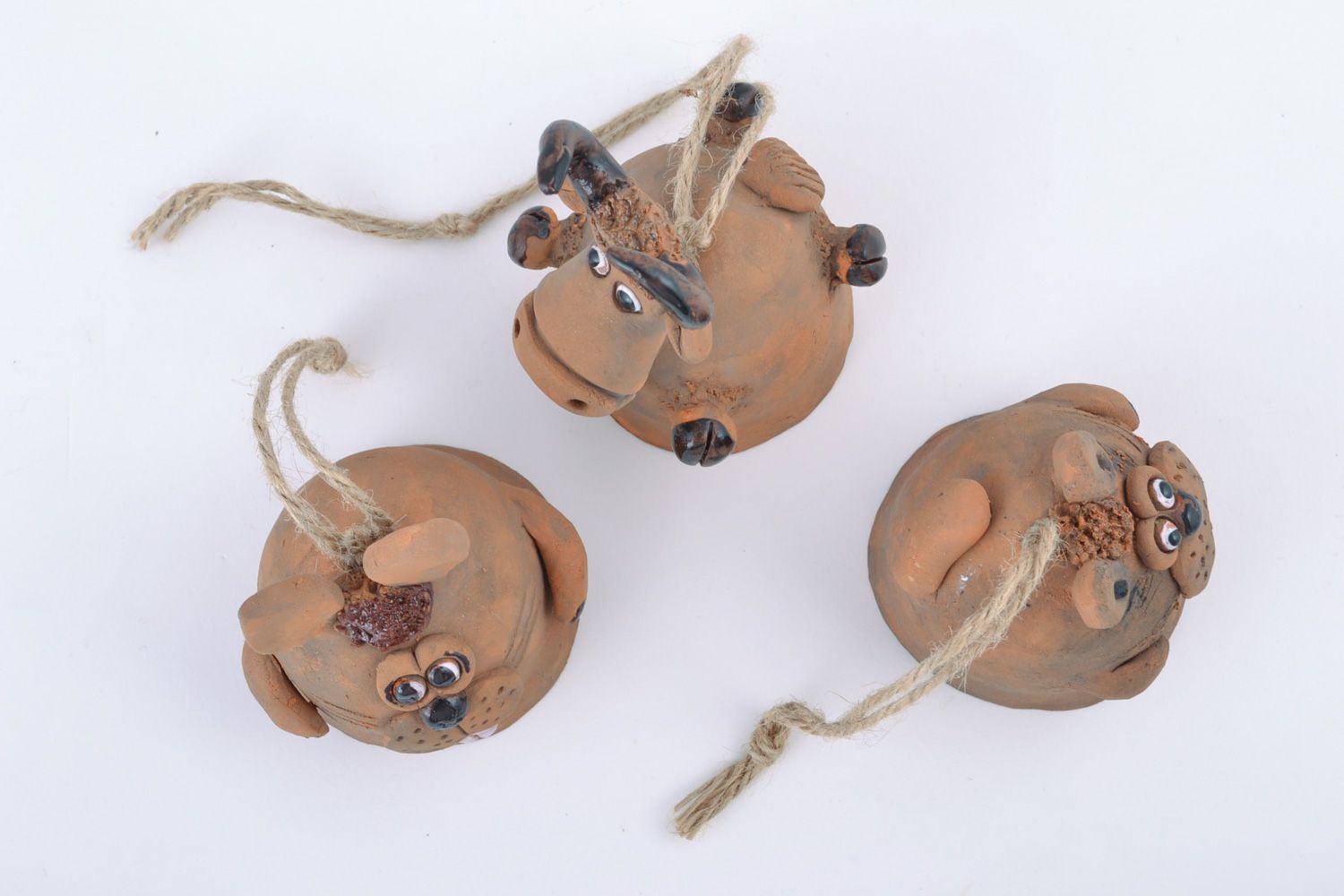 Set of handmade ceramic hanging bells in the shape of traditional toys animals photo 5
