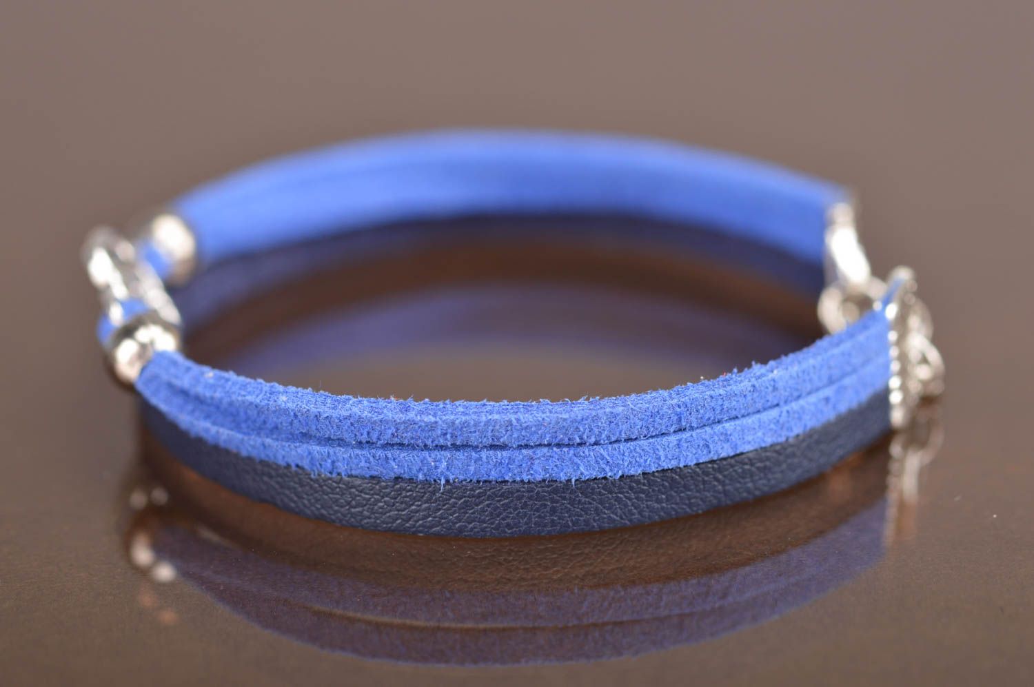 Handmade thin blue genuine leather cord wrist bracelet with metal flower element photo 4