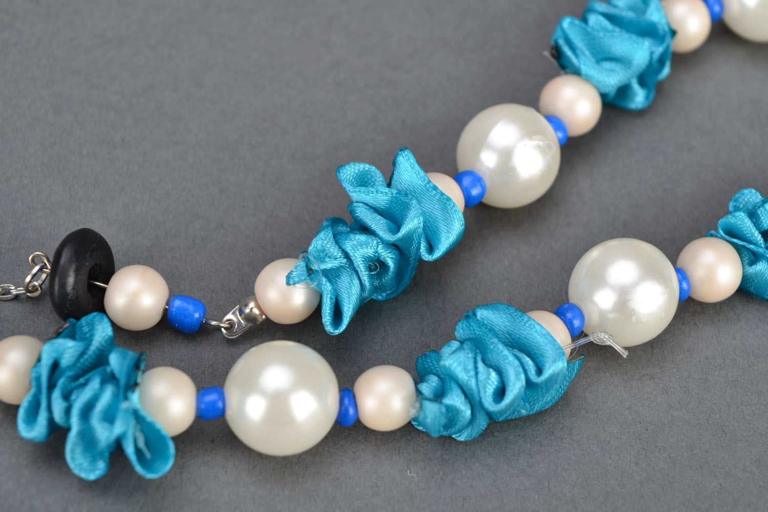 Beautiful necklace made of beads and satin photo 3