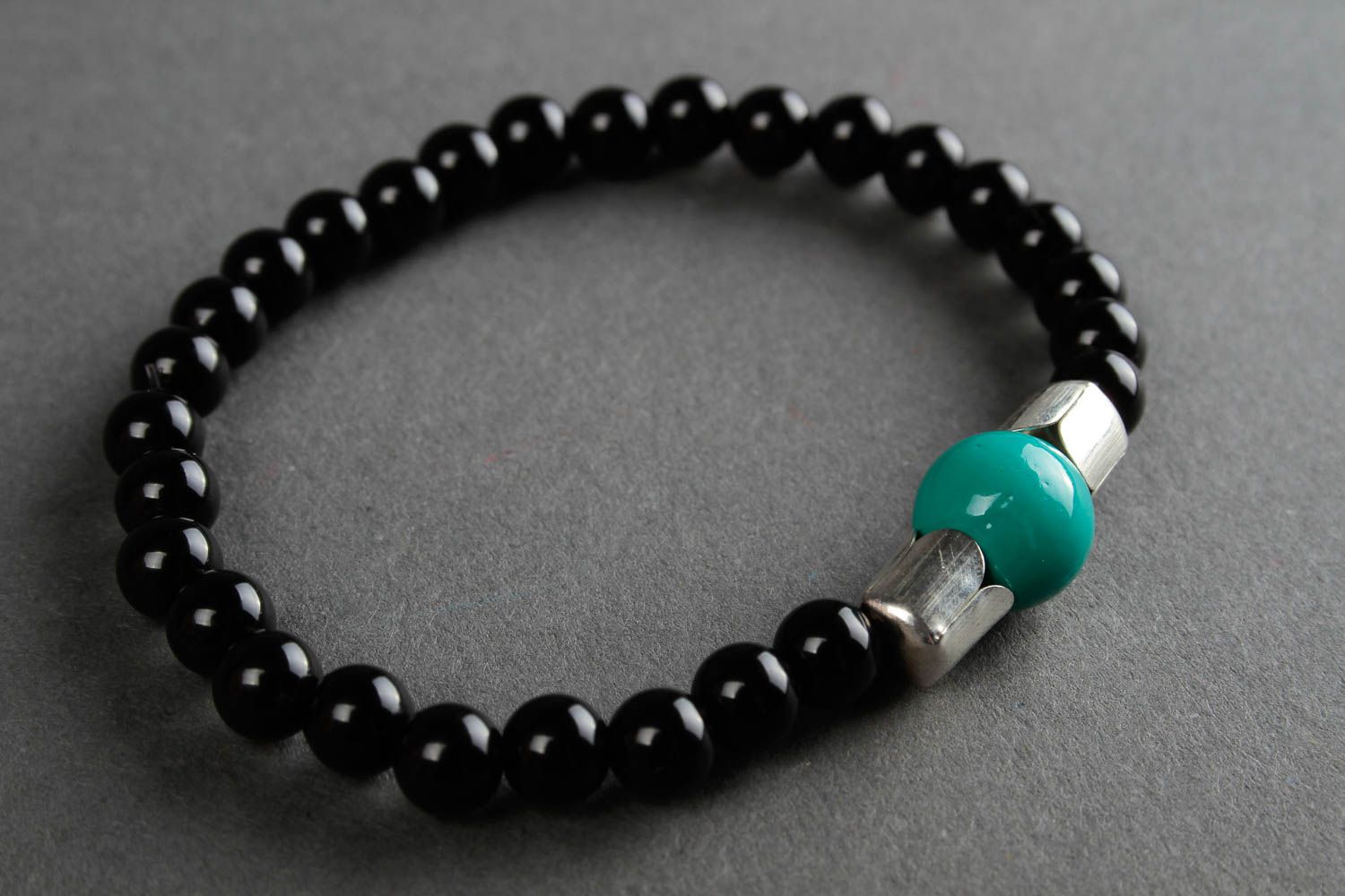 Black beads bracelet on elastic cord and center malachite bead. Unisex bracelet photo 3