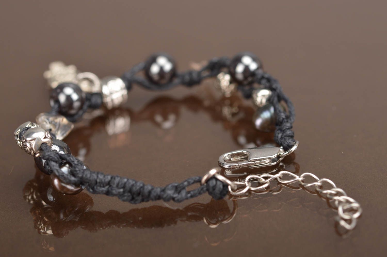 Handmade black woven bracelet made of threads beads and natural stones photo 5