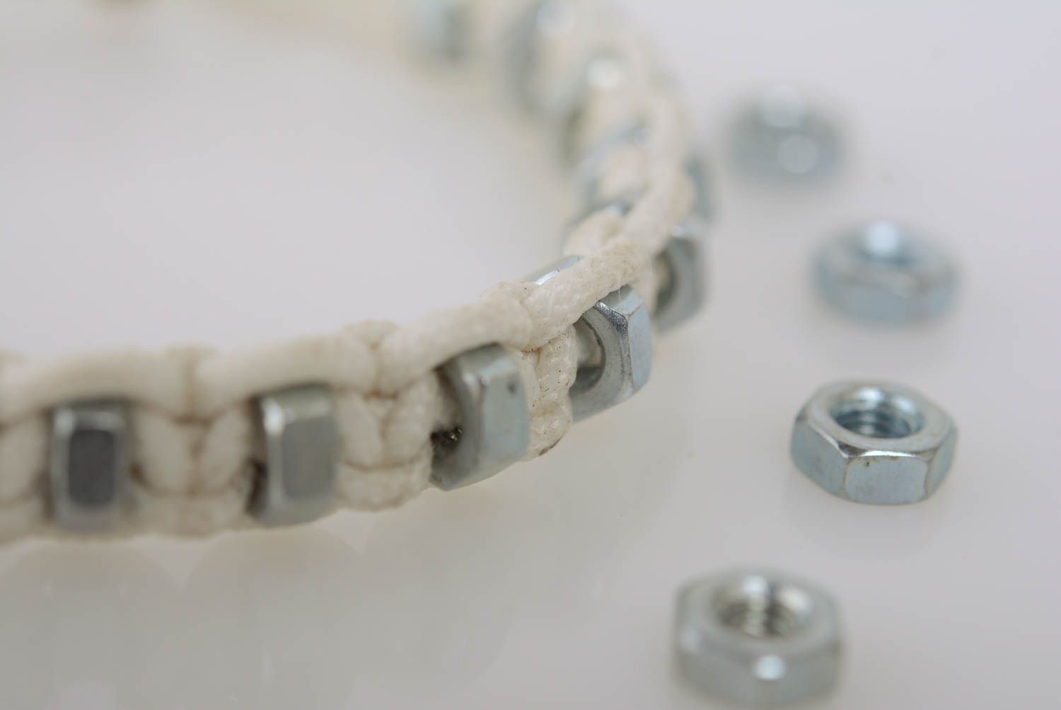 White women's handmade designer macrame woven cord bracelet with steel nuts photo 2
