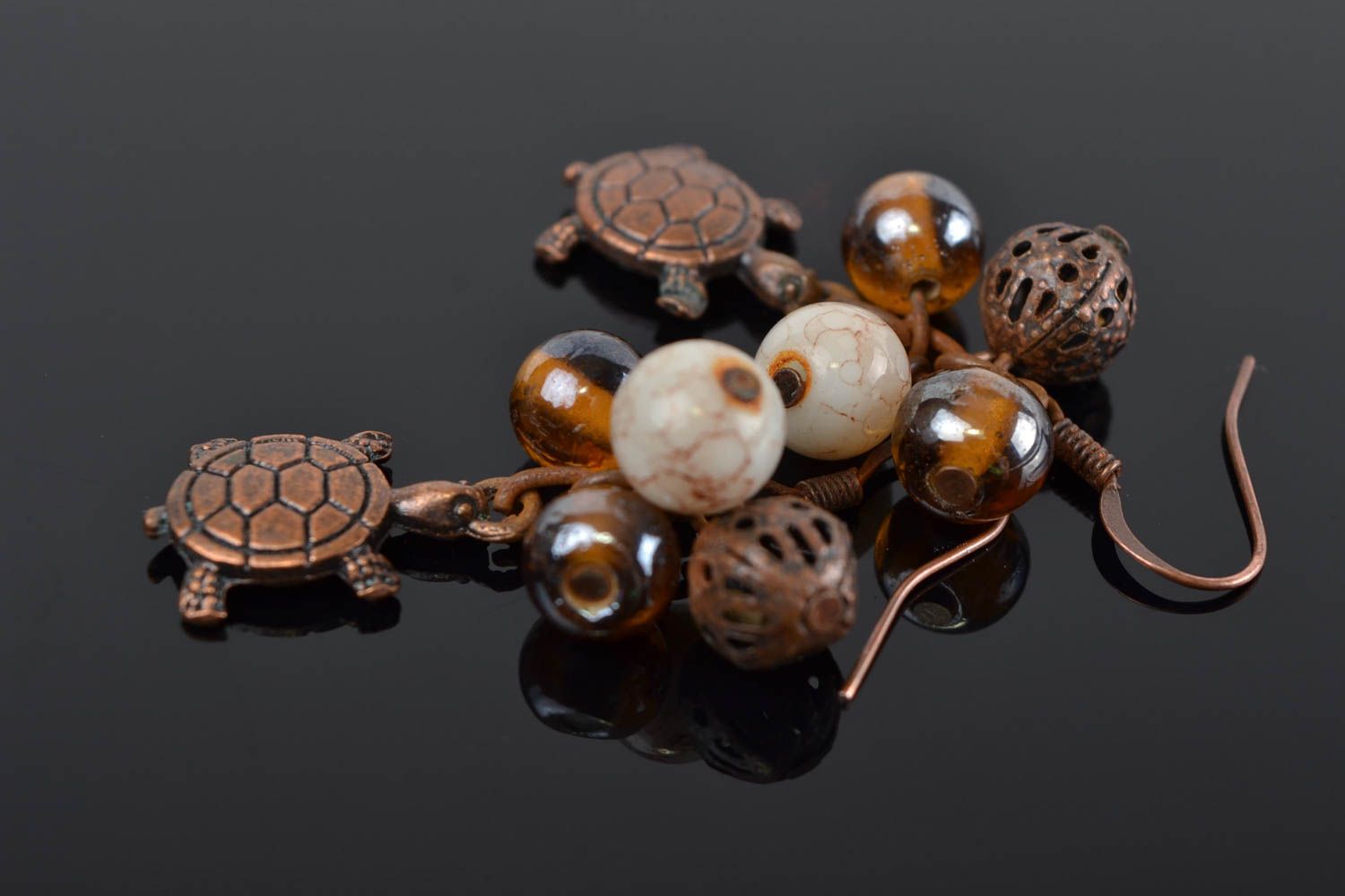 Handmade designer brown dangling earrings with glass beads and turtle charms photo 1