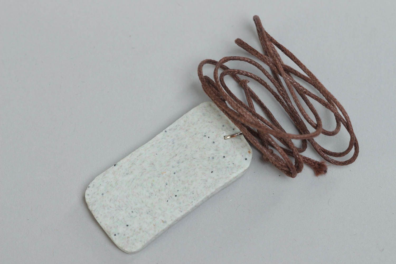 Handcrafted rectangle pendal made of polymer clay on a cord photo 4