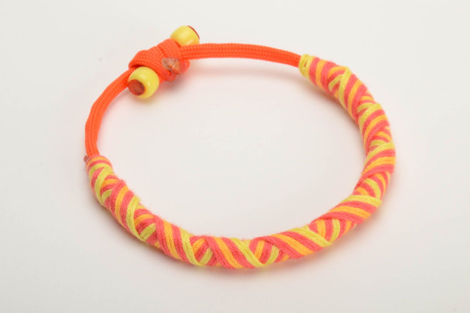 Orange and yellow handmade wrist bracelet woven of American paracord photo 4