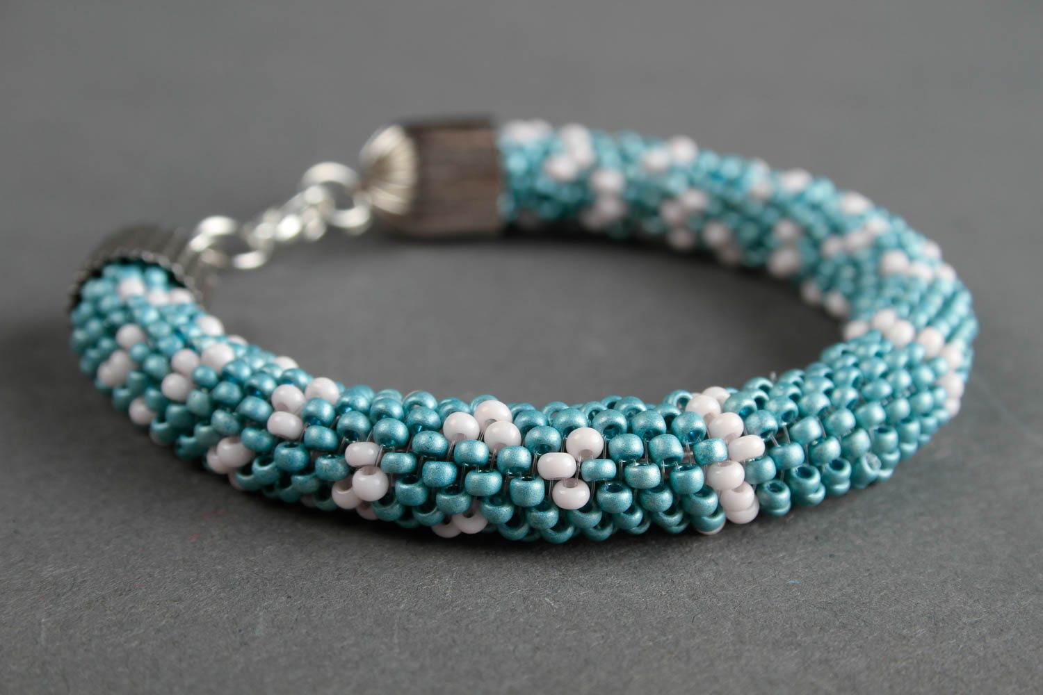 Handmade beaded cord bracelet in turquoise and white beads photo 3