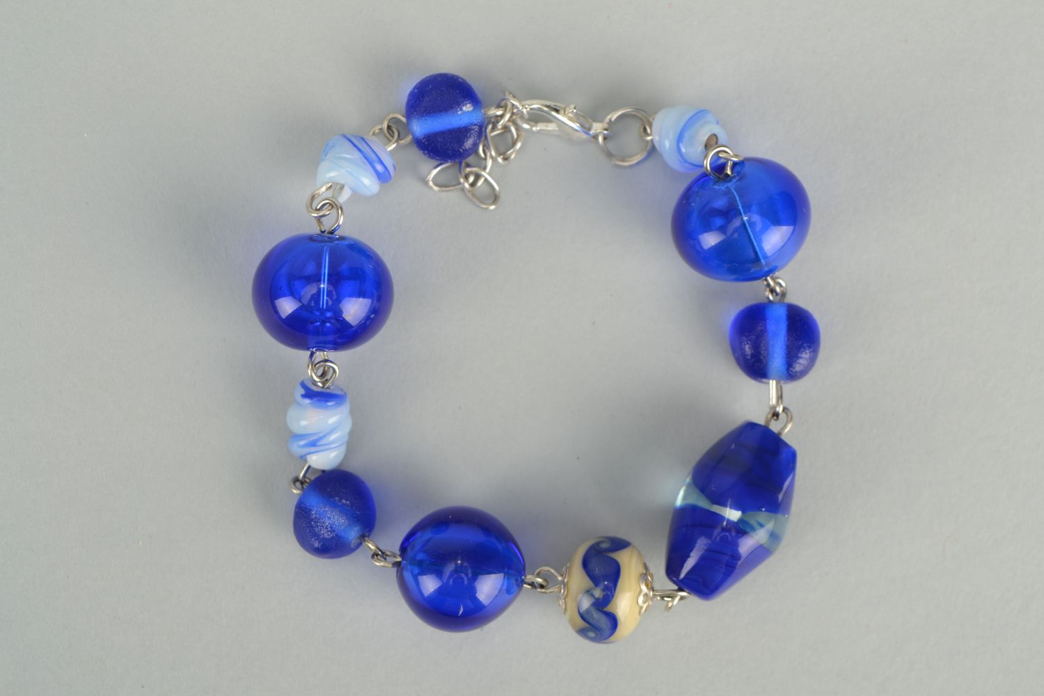 Interesting bracelet with blue lampwork glass beads photo 1