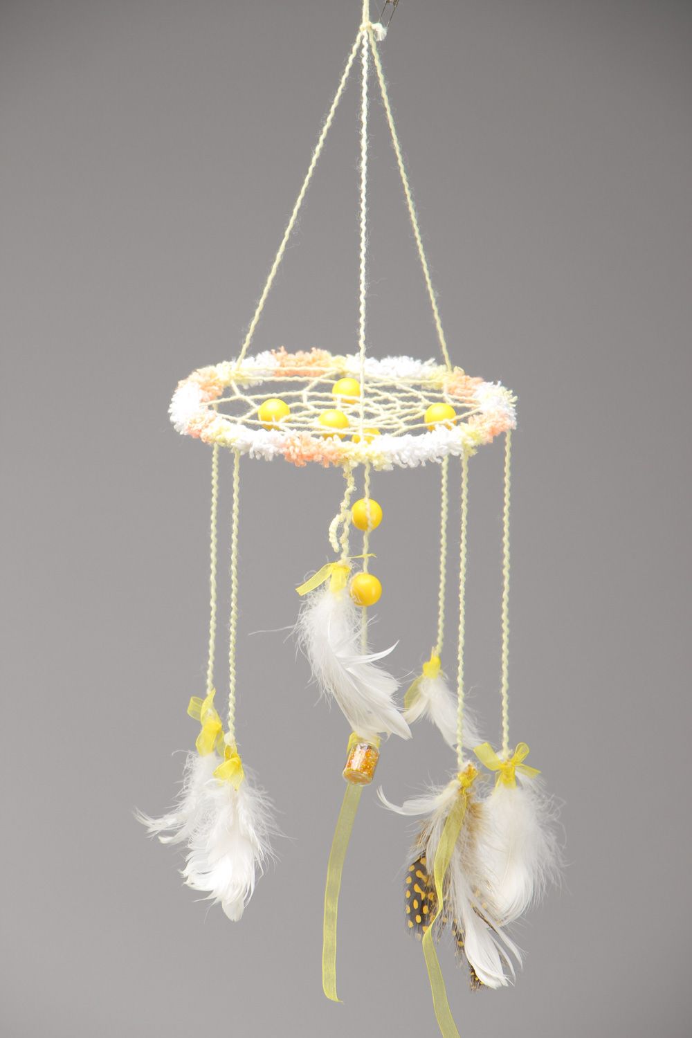 White and yellow homemade dreamcatcher wall hanging with feathers Sun Ray photo 2