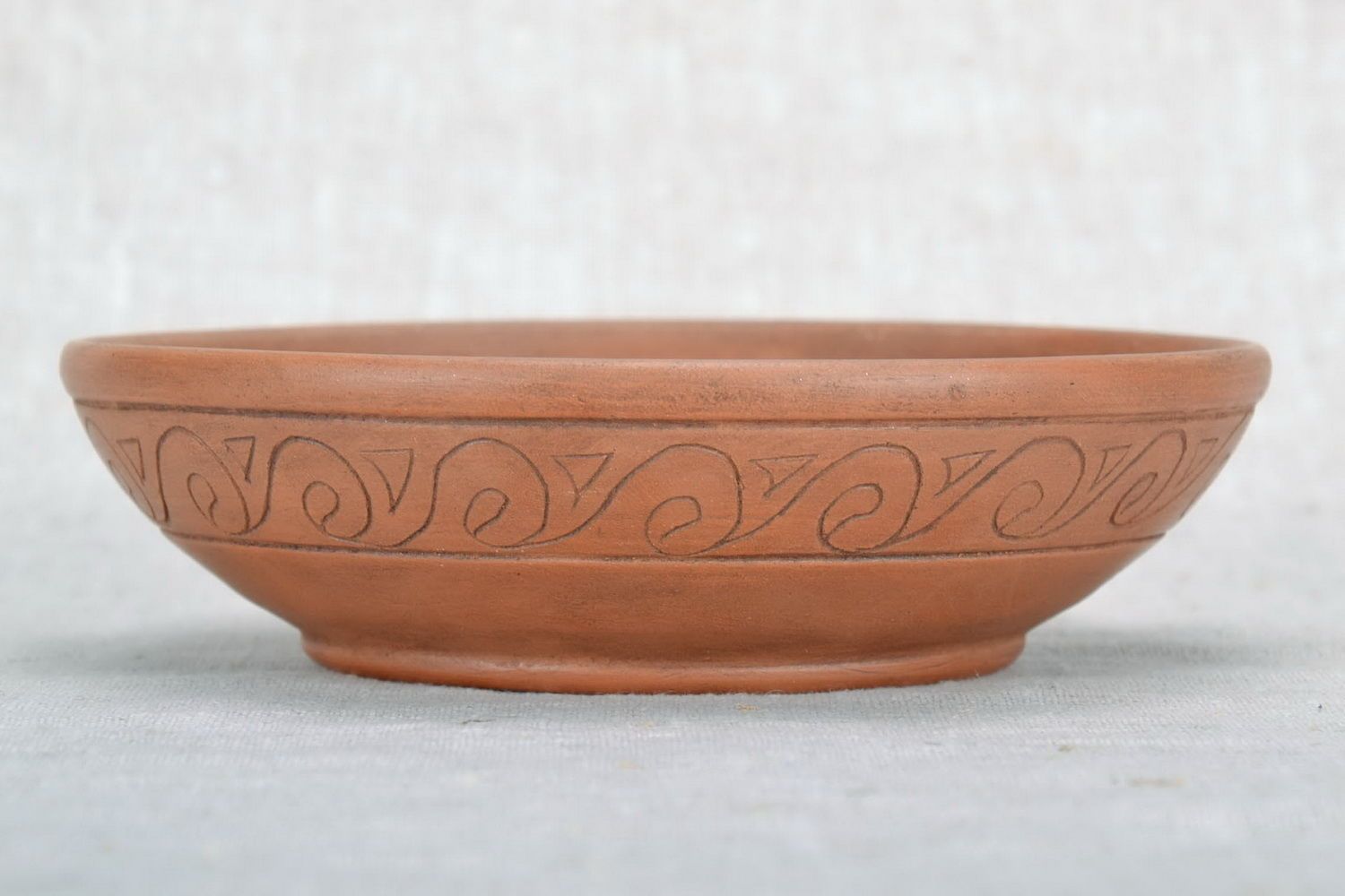 Clay bowl with an ornament photo 3