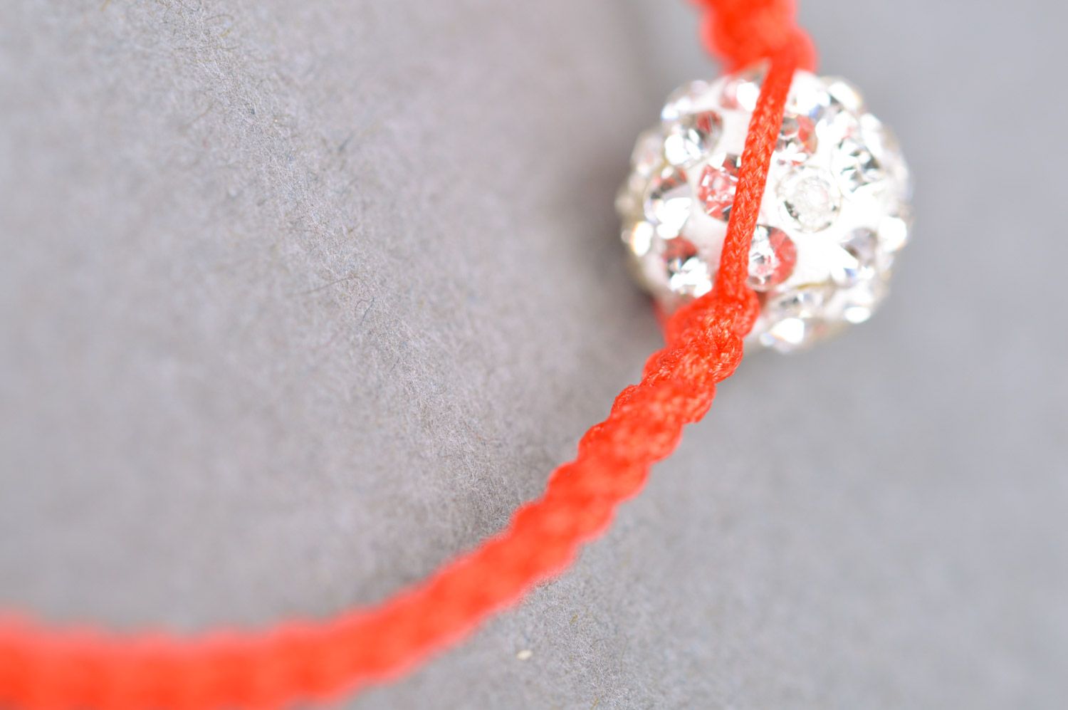 Red and white handmade wrist bracelet woven of threads and a bead photo 4