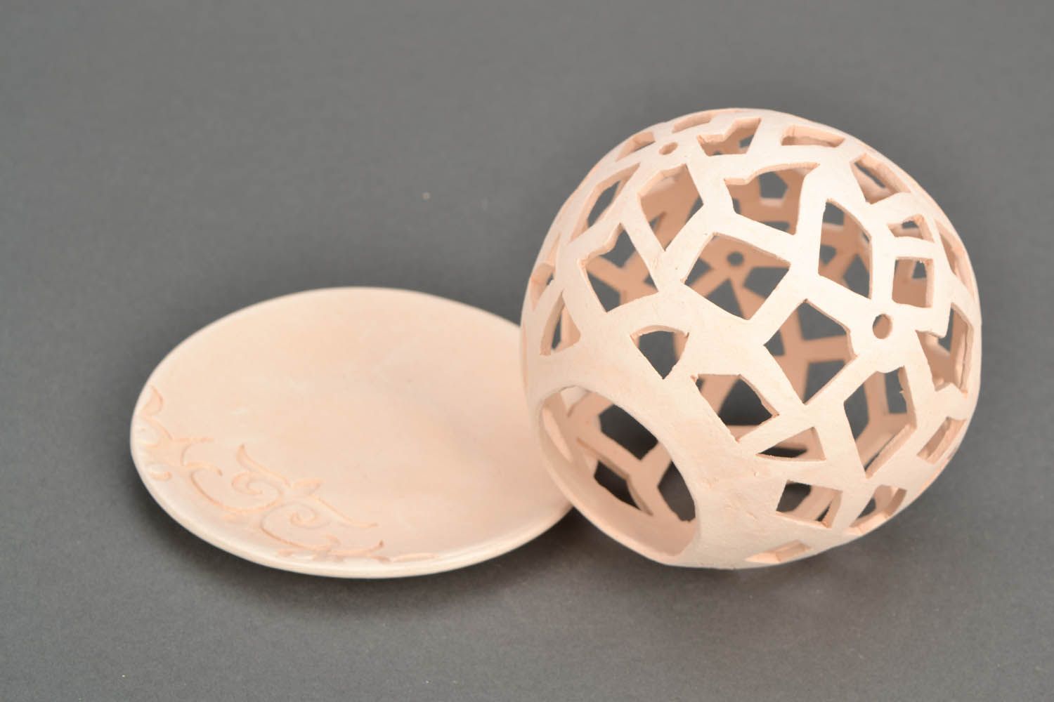 Castiçal cerâmico artesanal na forma de uma bola foto 4