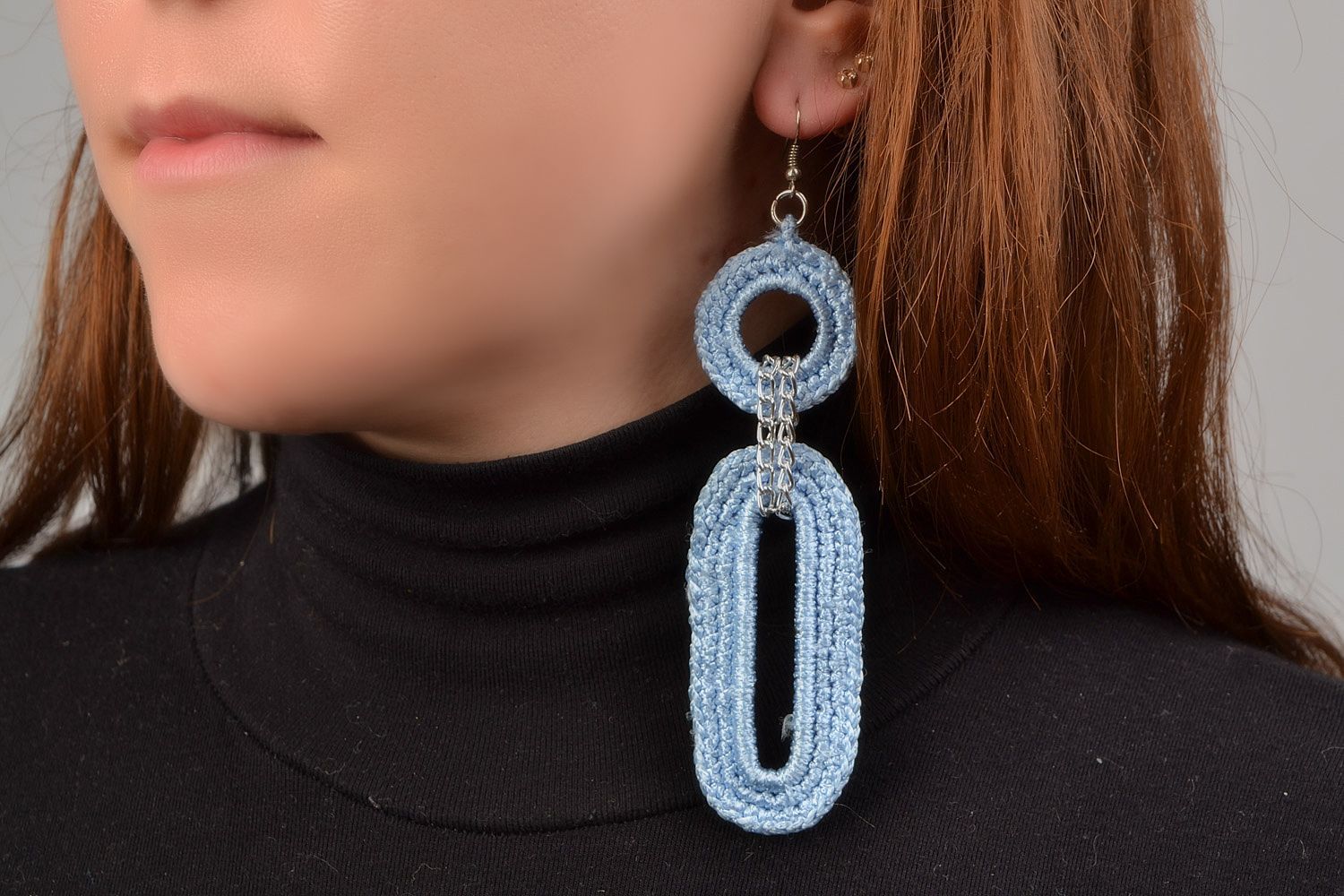Handmade earrings with metal basis woven over with blue viscose threads photo 1