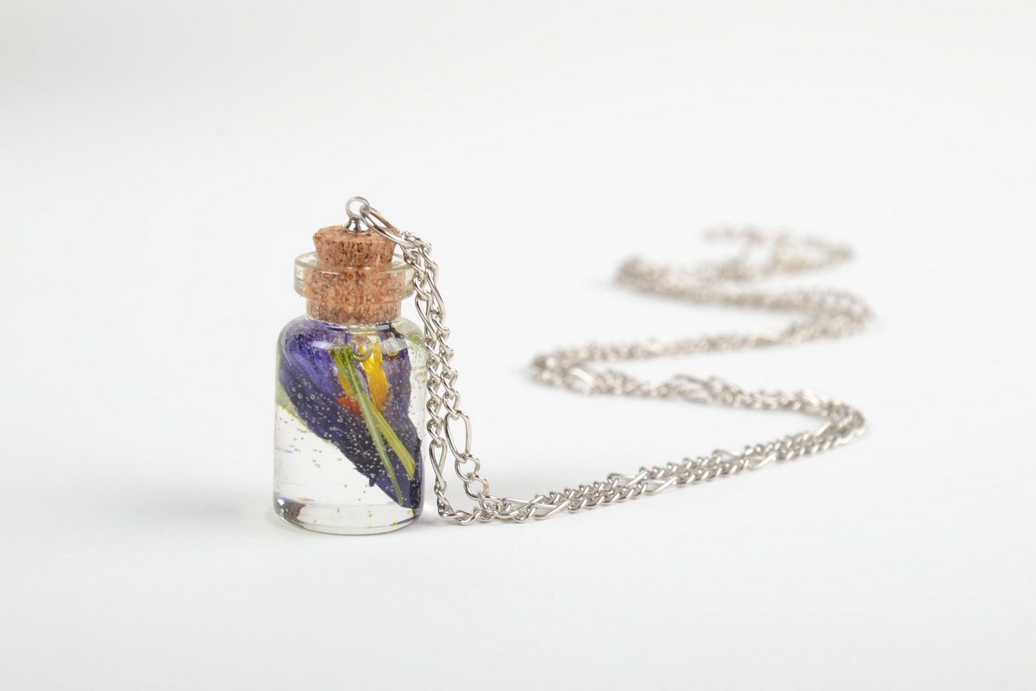 Handmade epoxy resin pendant with real flowers inside in the shape of vial photo 4