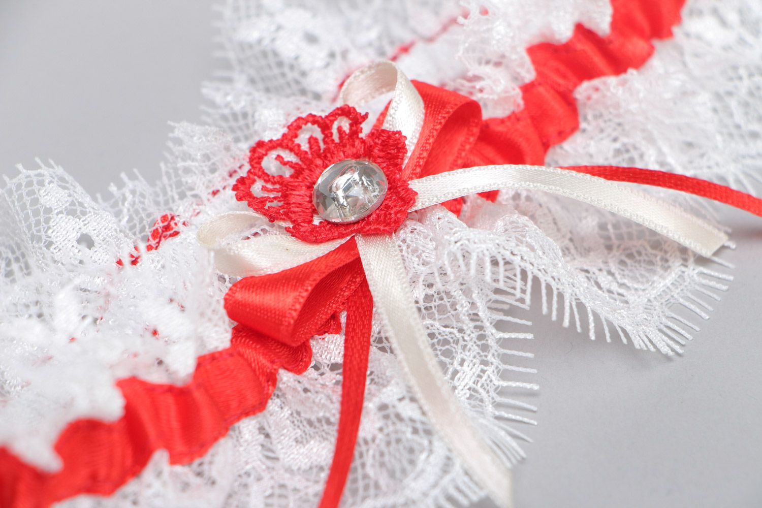 Handmade white wedding bridal garter with French lace and red satin ribbon photo 3