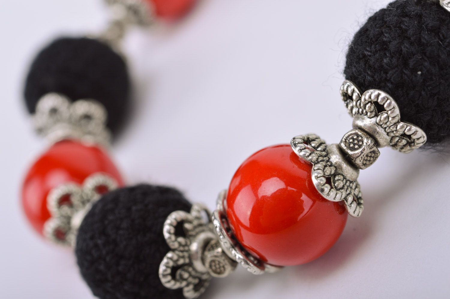 Handmade red and black wrist bracelet with beads crocheted over with threads Passion photo 4