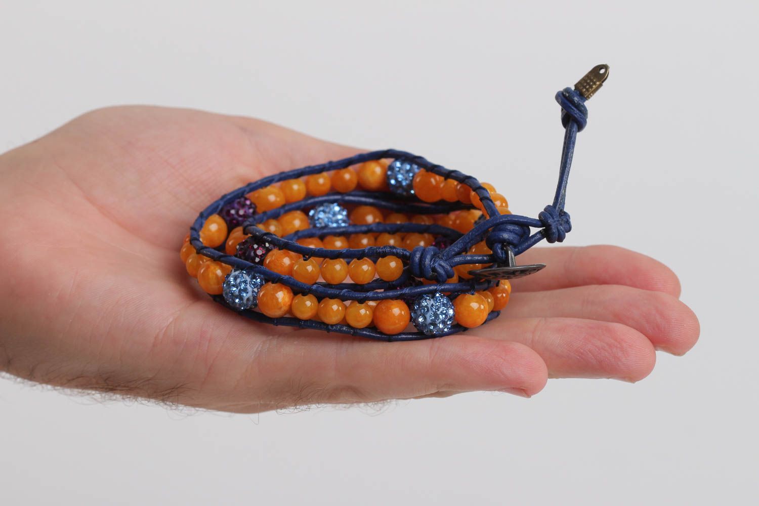 Three-layer orange beads strand bracelet on dark blue cord photo 5