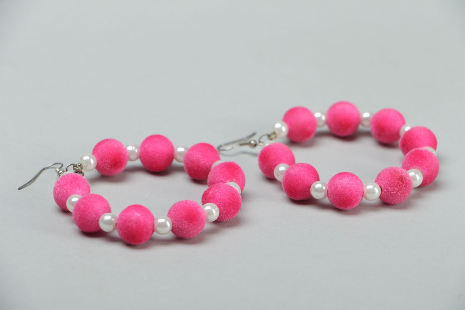 Large hoop earrings of pink color photo 2