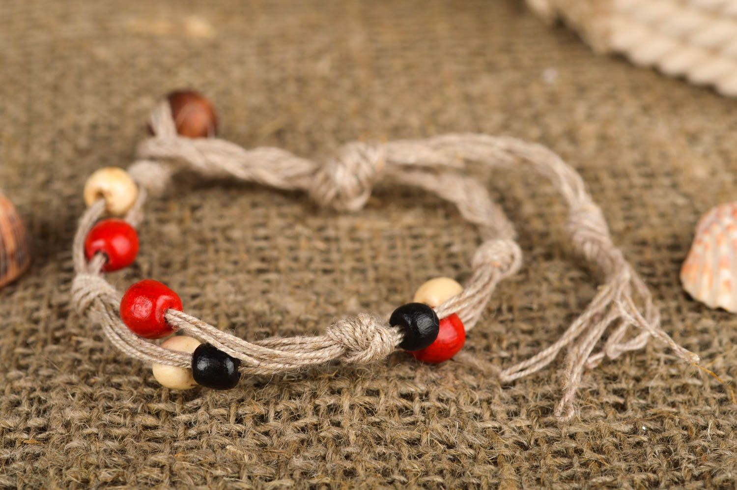 Strand beige rope two-row bracelet with red, black, white, yellow wooden beads for women photo 1