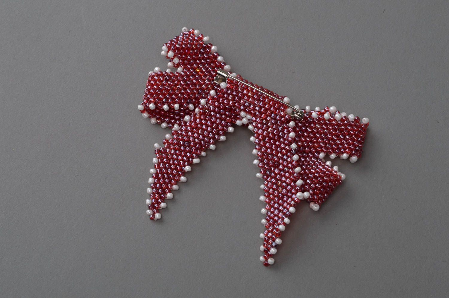 Small handmade brooch in the form of a bow made in red color with white accents photo 4