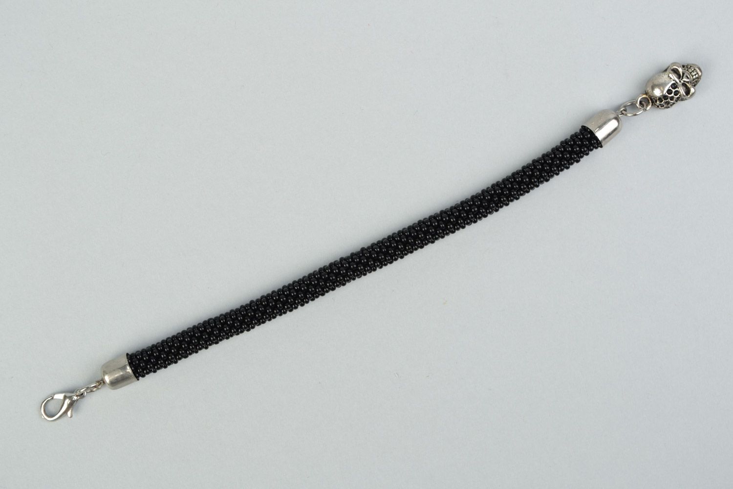 Handmade beaded cord women's wrist bracelet in black color with skull charm photo 5
