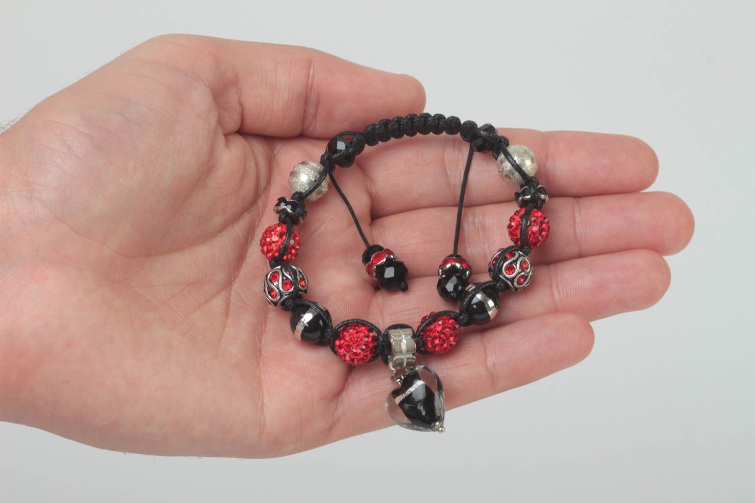 Black rope cord strand bracelet with black, red beads and heart-shaped charm photo 6
