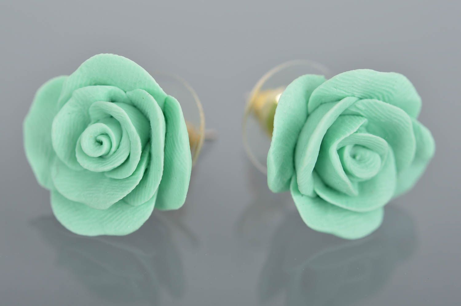 Beautiful handmade molded polymer clay flower stud earrings of mint color photo 2