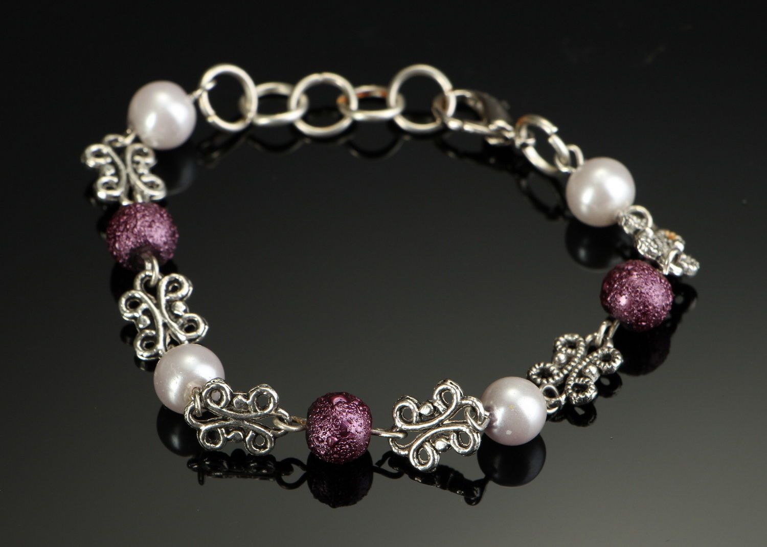 Chain bracelet made ​​of steel and ceramic pearls photo 2