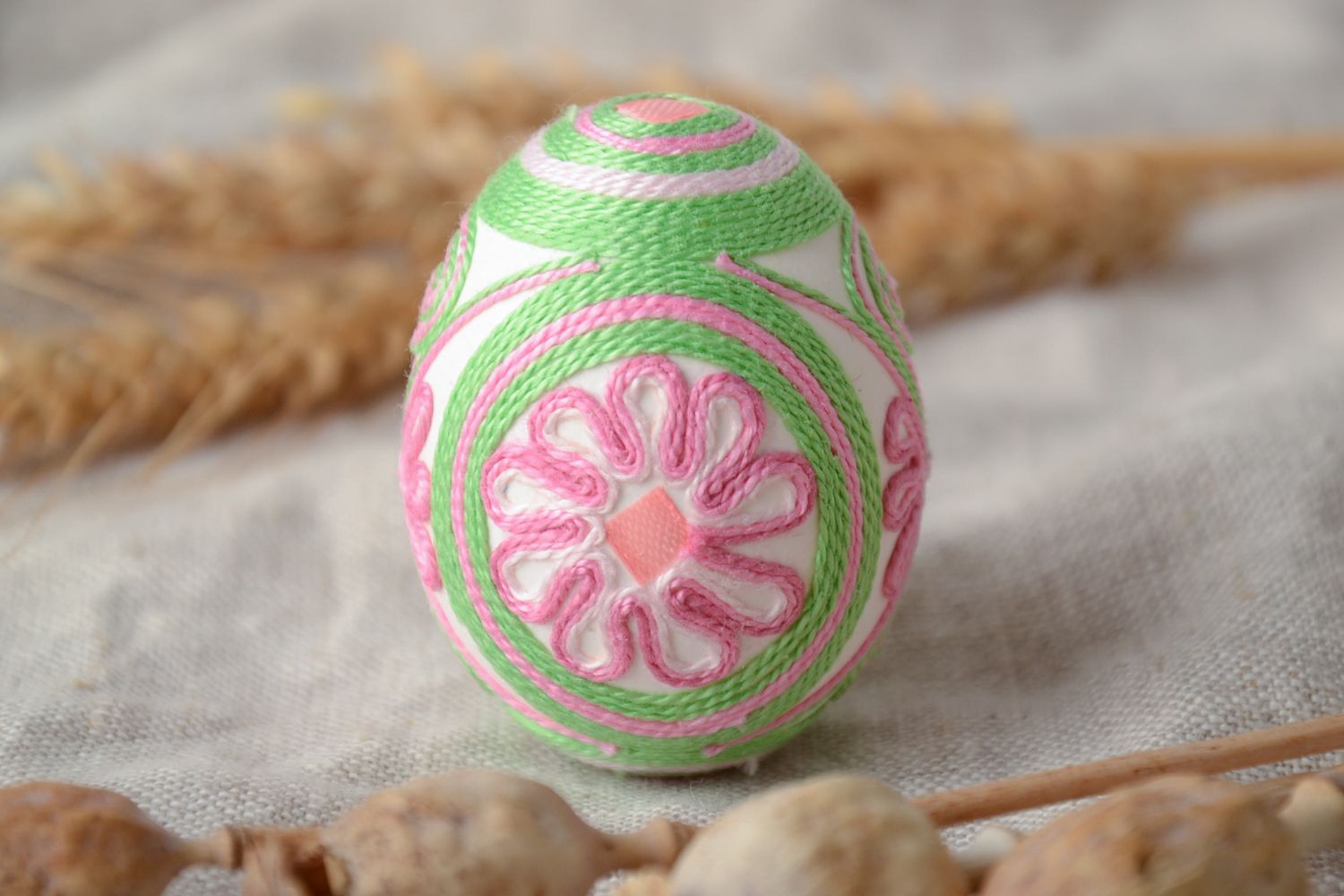 Decorative Easter egg ornamented with threads photo 1