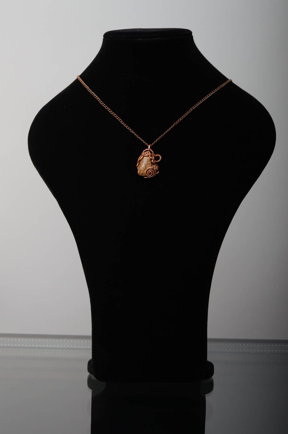 Copper pendant with natural bronzite stone photo 2