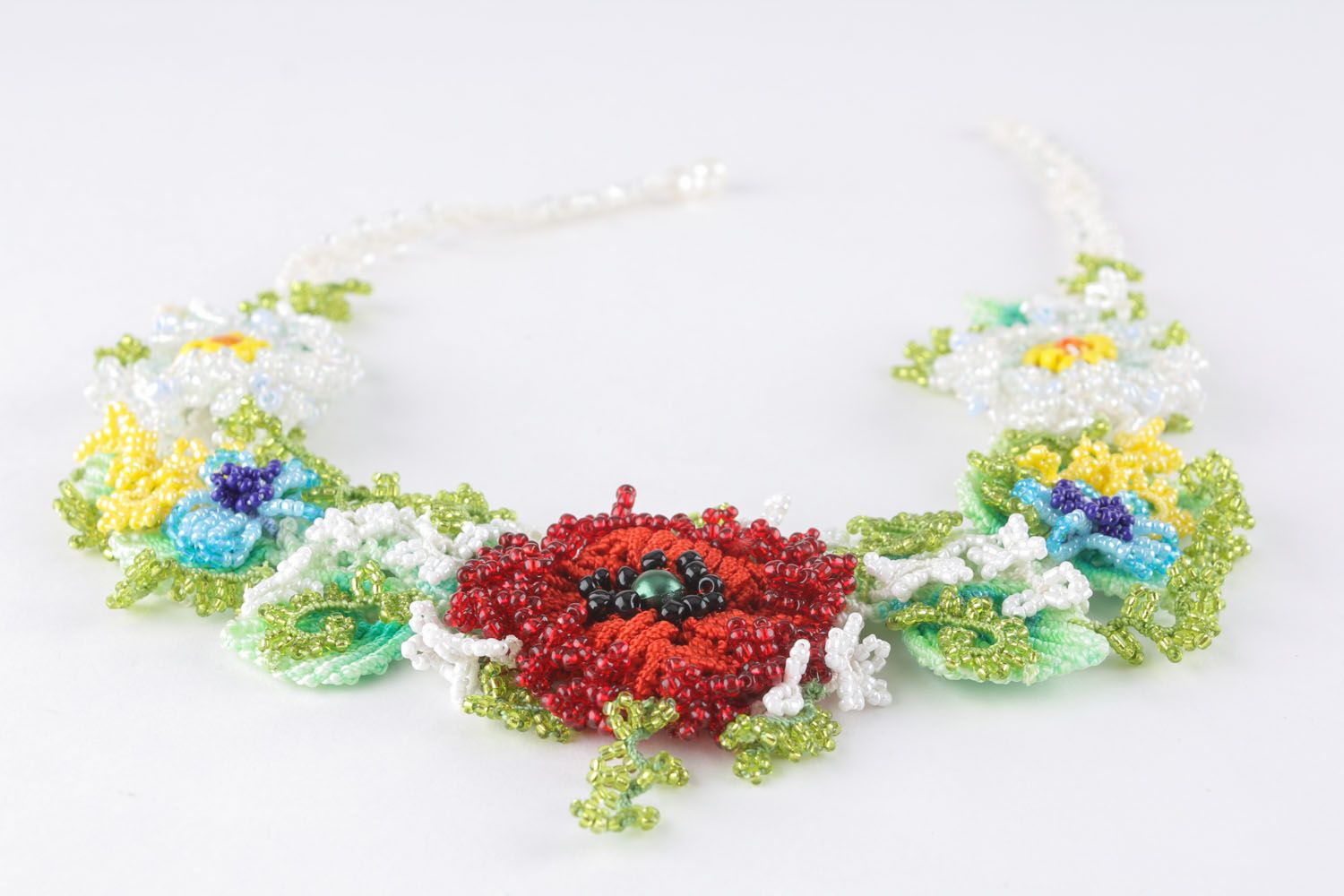 Necklace made of beads and threads using macrame technique photo 2