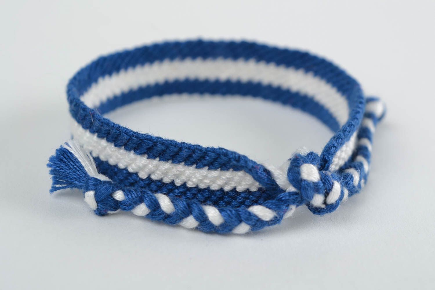 Handmade thin friendship wrist bracelet woven of blue and white threads photo 4