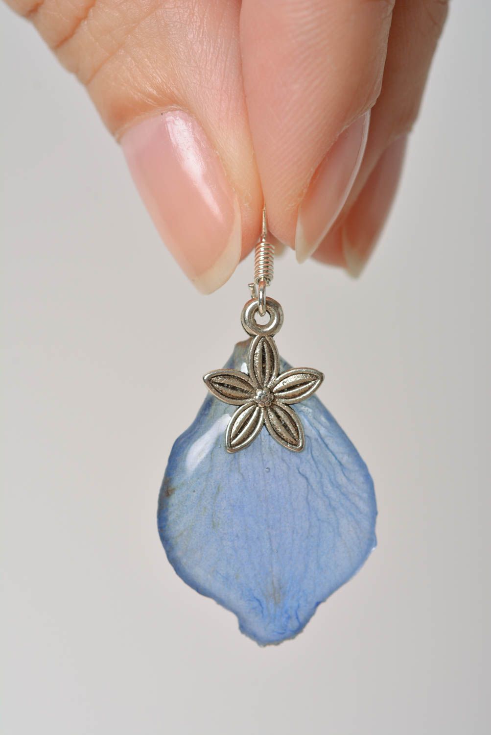 Beautiful homemade blue earrings with dried flowers coated with epoxy photo 2