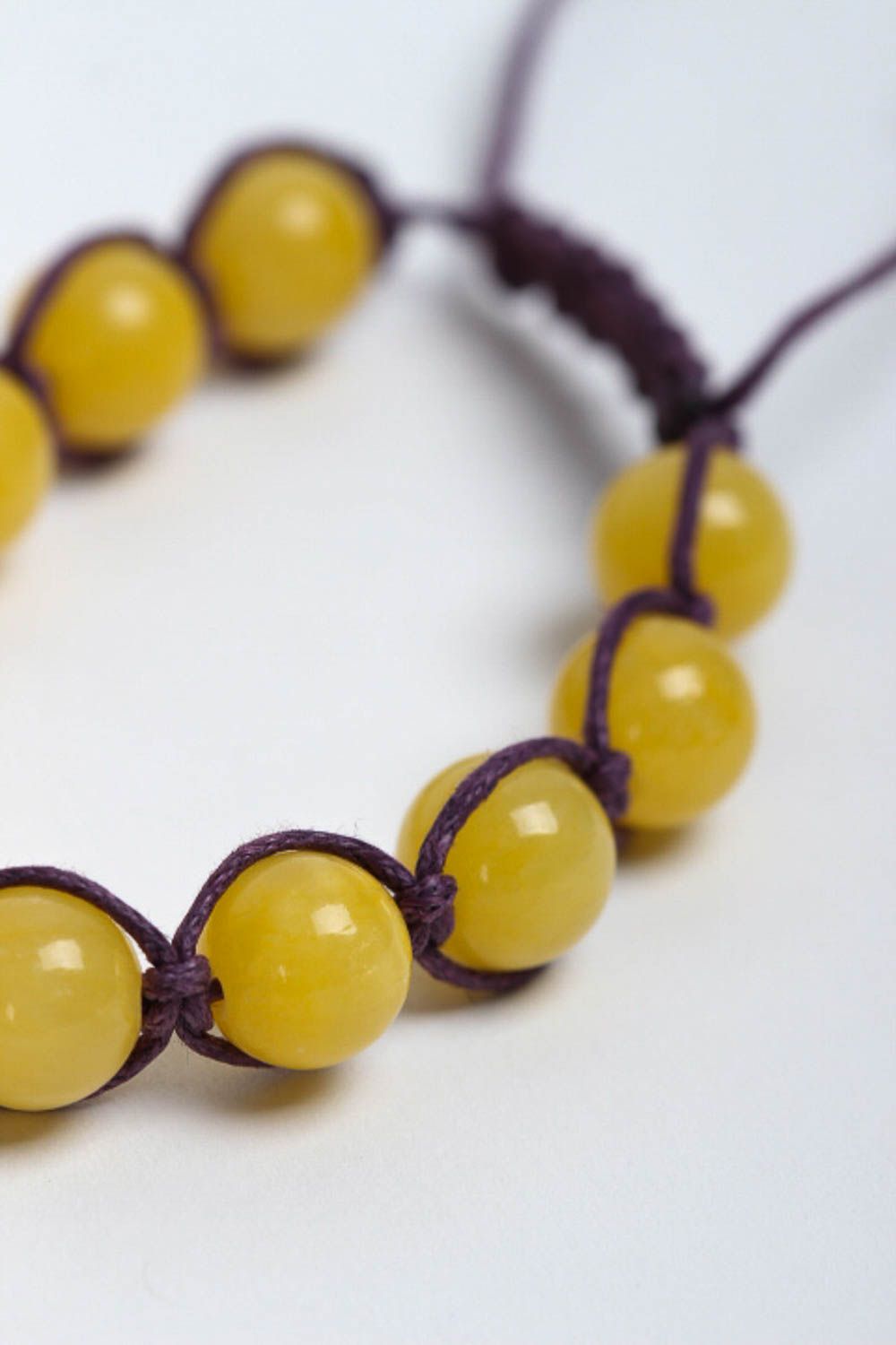 Yellow hematite and calcite beads strand bracelet on black cord  photo 3