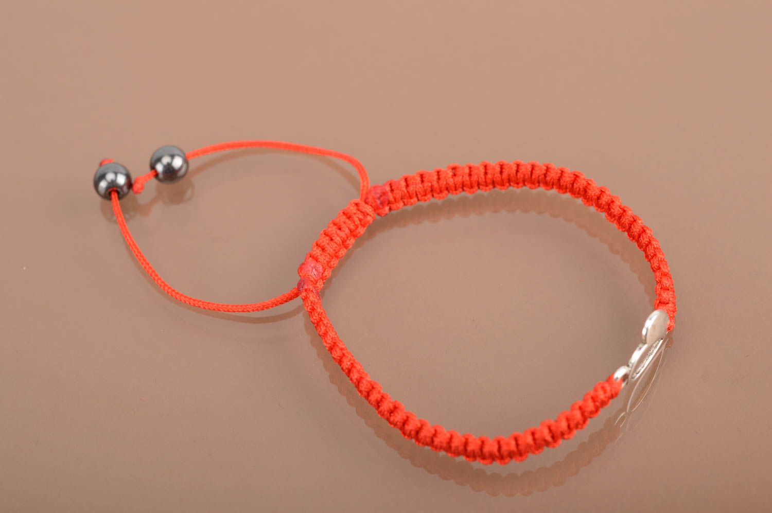 Beautiful thin woven silk thread bracelet of red color with heart hand made photo 5
