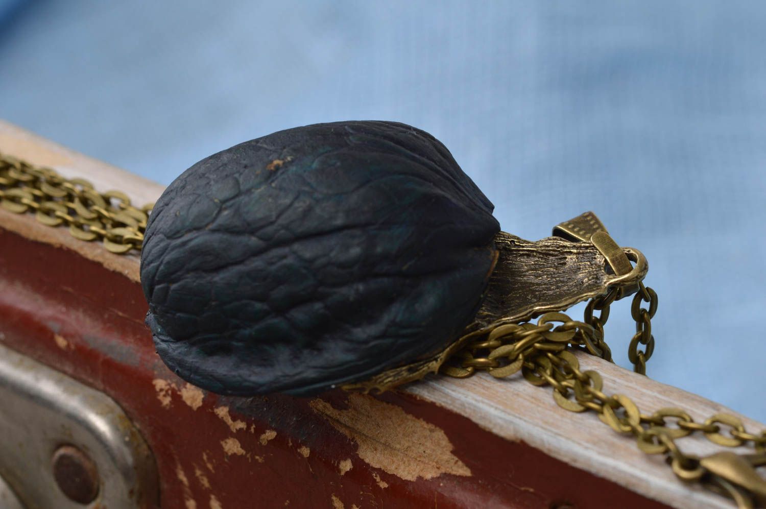 Luminous cute handmade pendant made of nut with metal hand Hand on heart photo 3