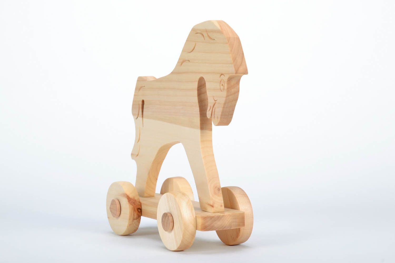 Маленькая деревянная игрушка лошадка фото 4