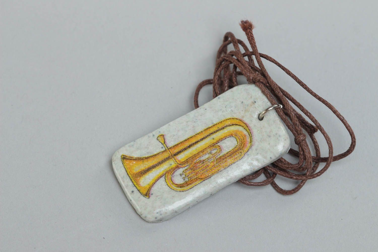 Handcrafted rectangle pendal made of polymer clay on a cord photo 2