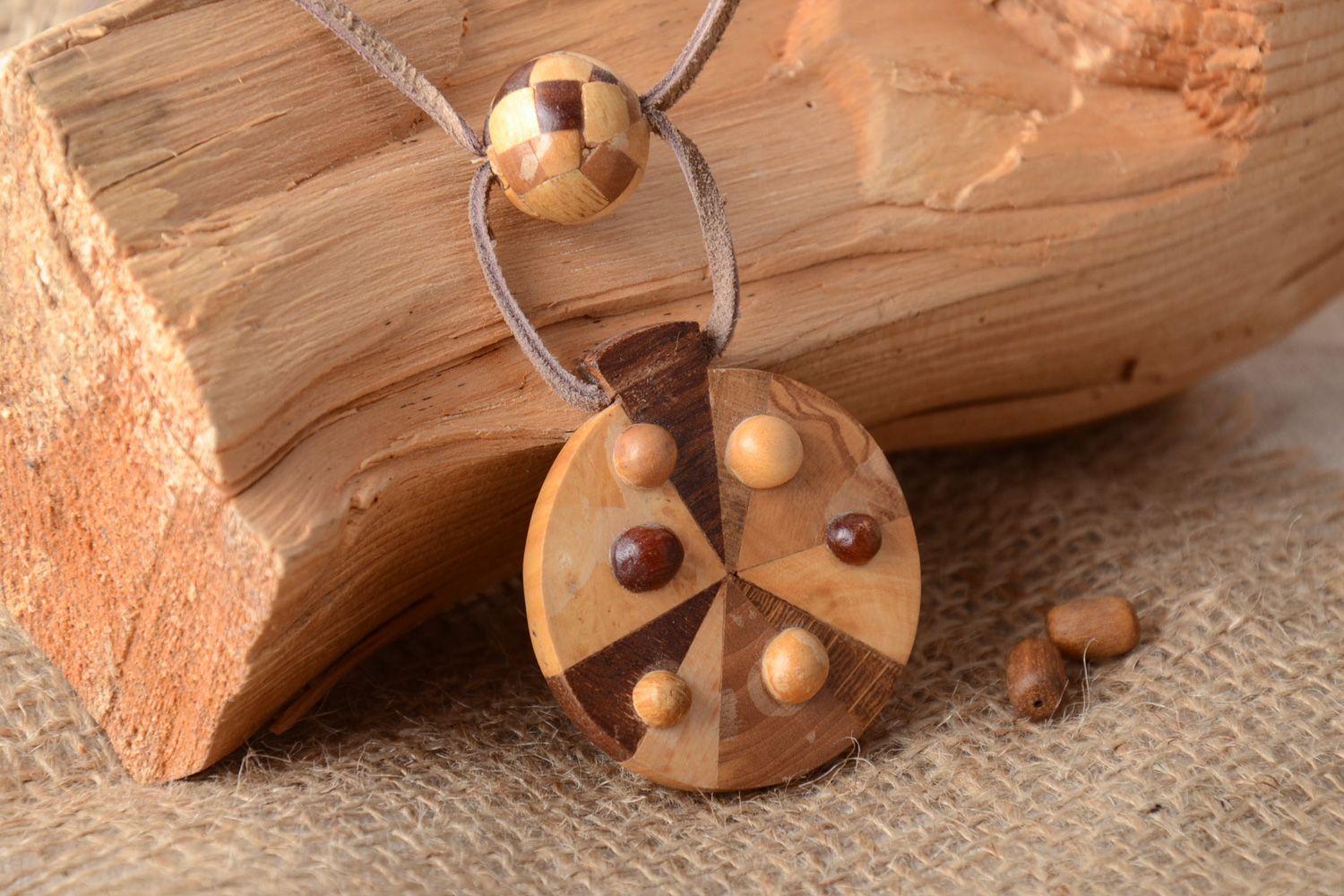 Handmade round neck pendant carved of wood and decorated with intarsia for women photo 1