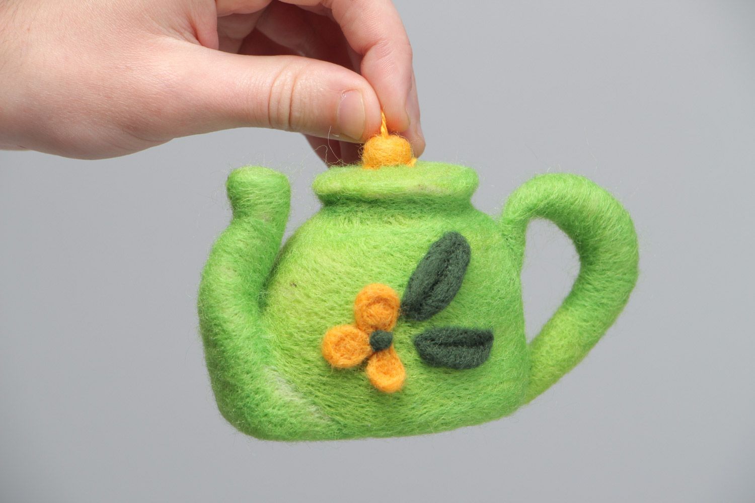 Handmade decorative toy made using the technique of dry felting green kettle with eyelet photo 5